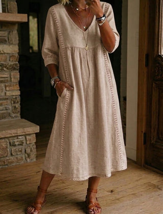 Beige V-neck maxi dress with 3/4 sleeves and gathered bodice