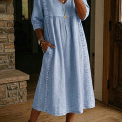 Blue V-neck maxi dress with 3/4 sleeves and gathered bodice