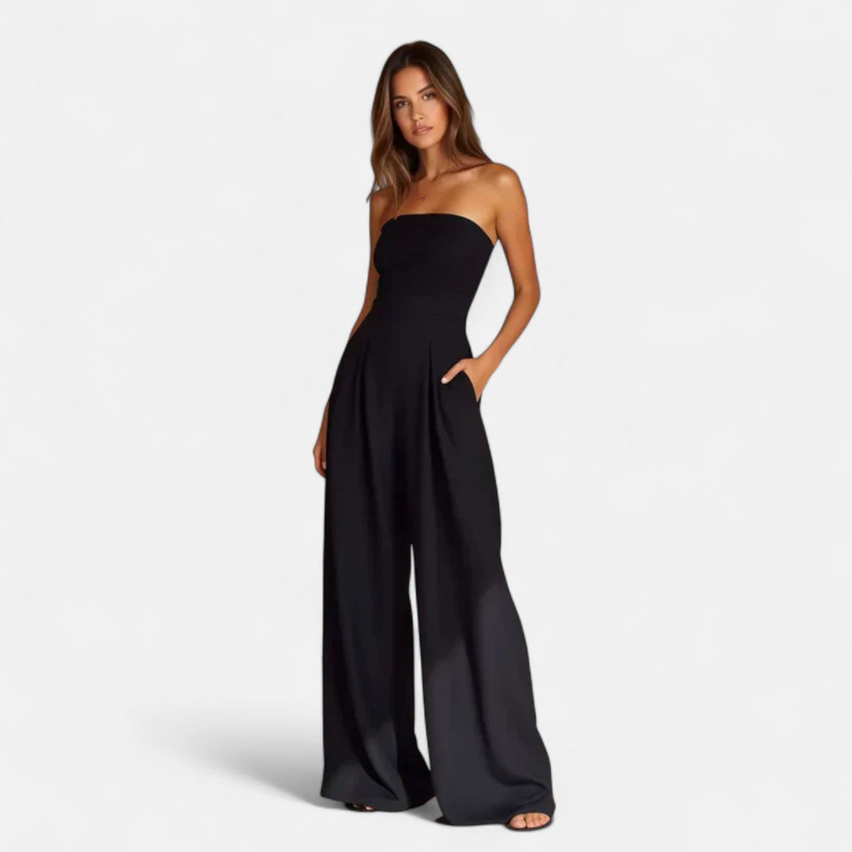 Black strapless lightweight jumpsuit with wide legs and flowing drape