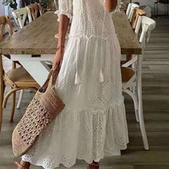 White tiered eyelet maxi dress with short puff sleeves and scalloped hem