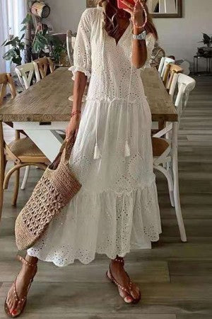 White tiered eyelet maxi dress with short puff sleeves and scalloped hem
