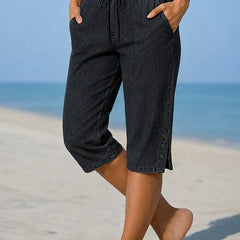 Delphia™ women's calf-length capri pants in black with drawstring waist and side buttons