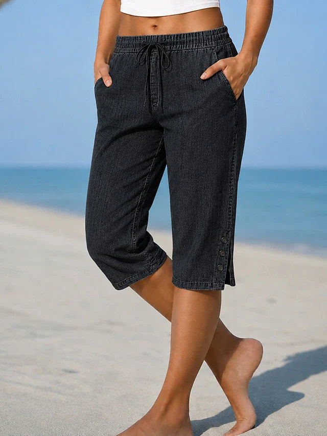 Delphia™ women's calf-length capri pants in black with drawstring waist and side buttons