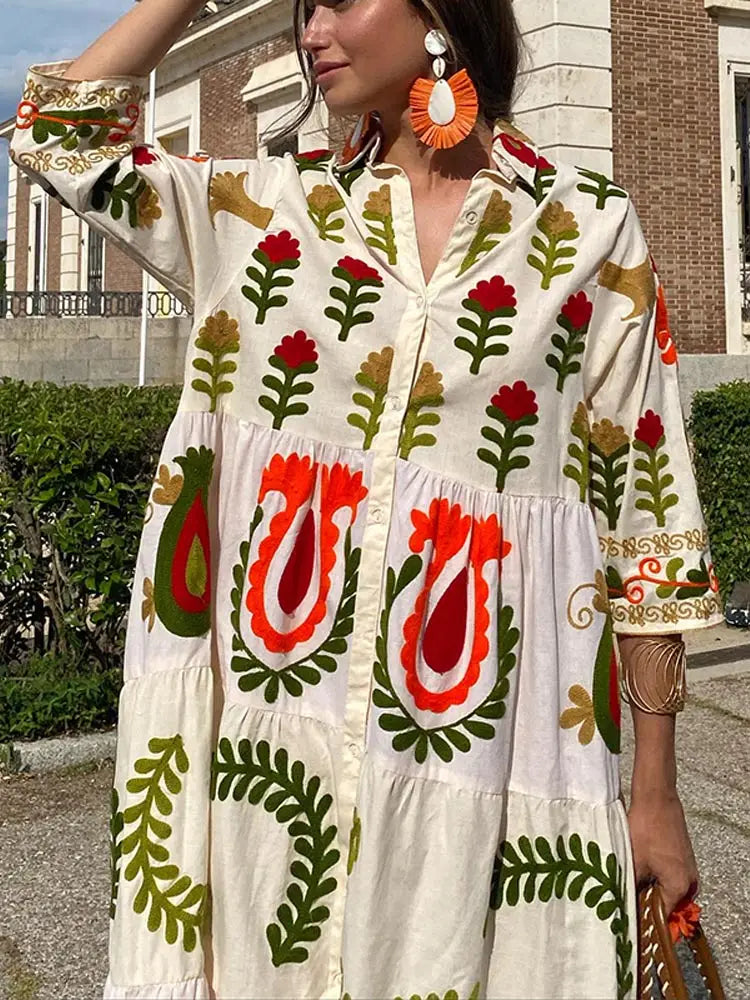 White V-neck dress with elbow-length sleeves and red green folk floral embroidery