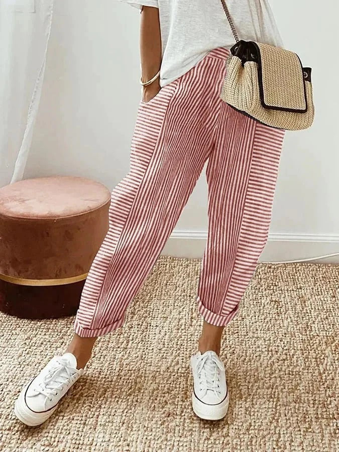 Red striped trousers with wide legs and cuffed ankle hems