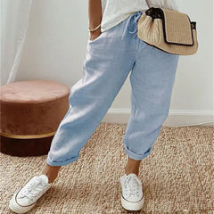 Light blue cotton trousers with elastic waist and cuffed hems