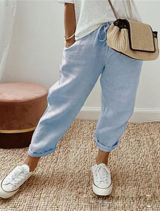 Light blue cotton trousers with elastic waist and cuffed hems