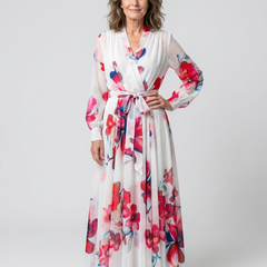 Floral long-sleeve wrap maxi dress in white with red, pink, and blue blooms; tie waist