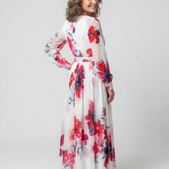 Floral long-sleeve wrap maxi dress in white with red and blue blooms; tie at waist