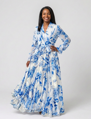 Floral long-sleeve wrap maxi dress in white with blue blooms; ruched tie waist
