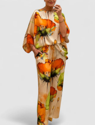 Two-piece set with short-sleeve caftan top and wide-leg pants, orange floral print