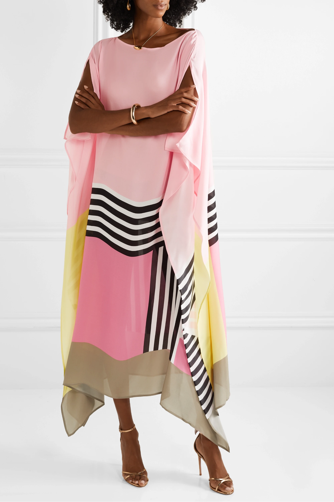Pink geometric kaftan with wide sleeves and layered stripe bands, draped hem
