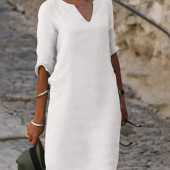 Yellow V-neck dress with elbow-length sleeves and a straight, knee-length fit