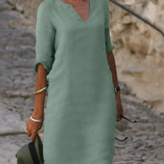 Orange V-neck dress with elbow-length sleeves and a straight, knee-length fit