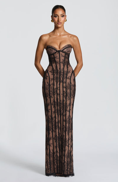 Black lace maxi dress on white background, sweetheart neckline and corset-style shaping