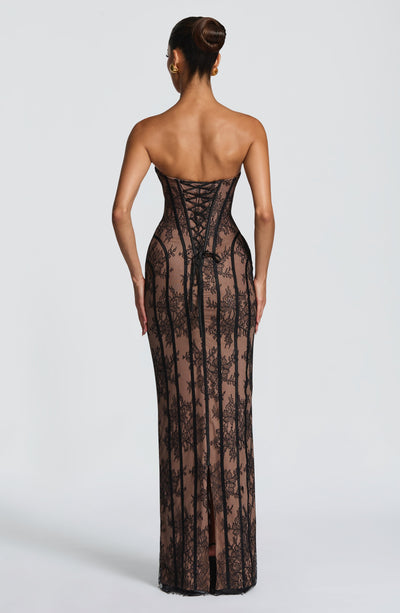 Black maxi dress back view with corset-style shaping and vertical stripe lace
