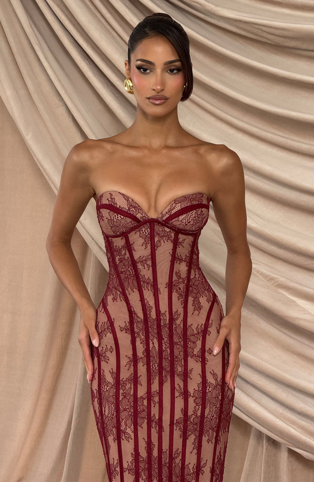Burgundy strapless lace maxi dress with sweetheart neckline and fitted corset shape