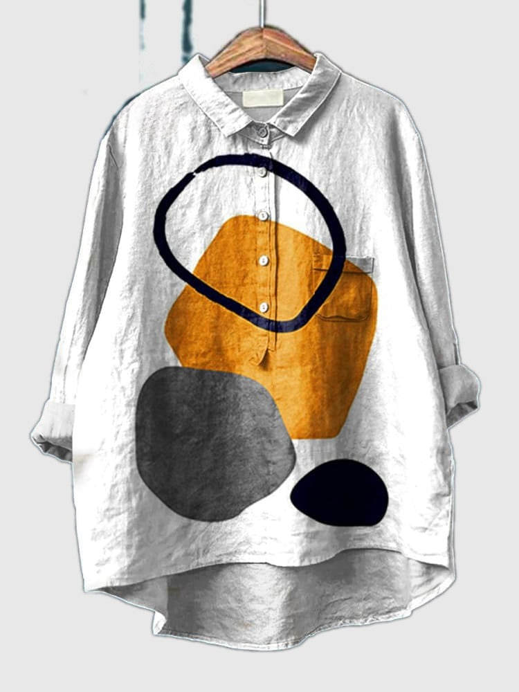 Geometric abstract print shirt with white base and orange/black circle shapes