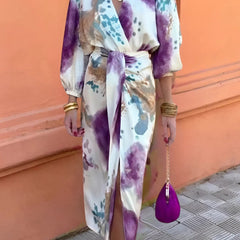 Watercolor print maxi dress with V-neck wrap front, tie waist, thigh-high slit, sleeves.