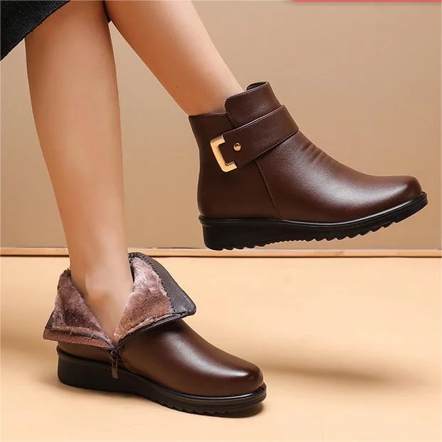 Brown ankle boots with faux-fur cuff and side buckle strap