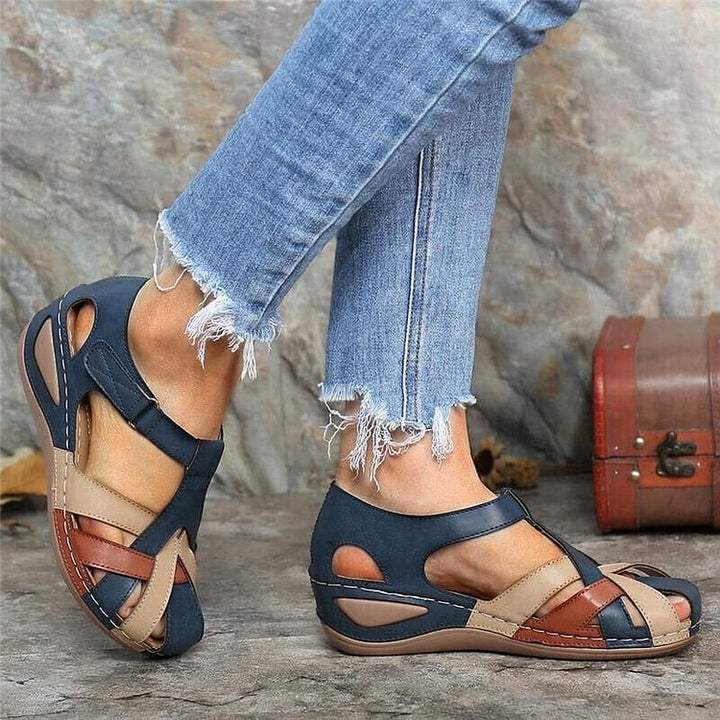 Navy casual sandals with beige straps and cushioned sole