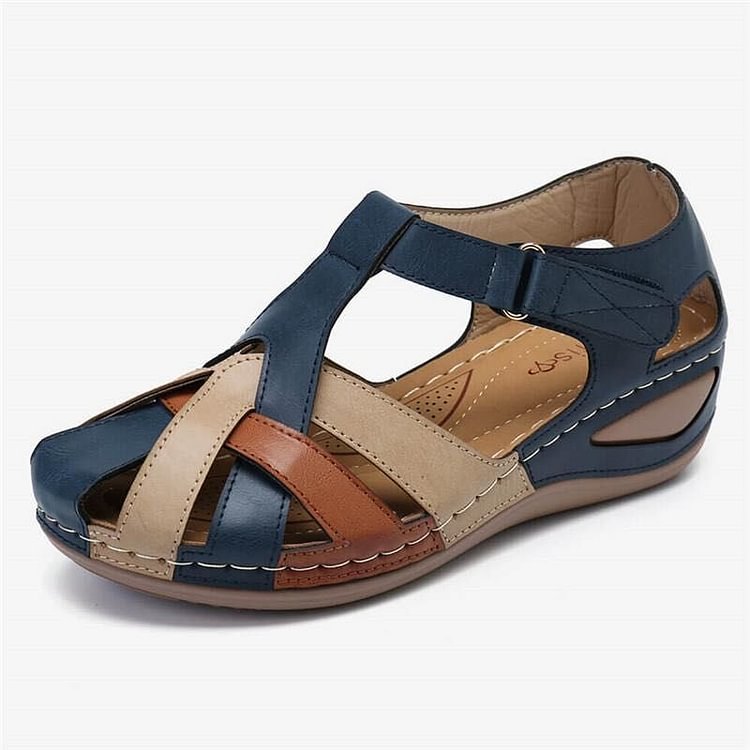 Navy and tan casual sandals with cross straps and cushioned platform sole