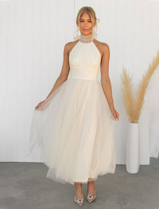 Ivory turtleneck tulle dress with halter neckline and full gathered skirt