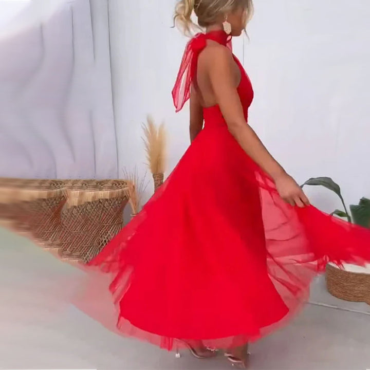 Red halter tulle dress with open-back strap and flared skirt