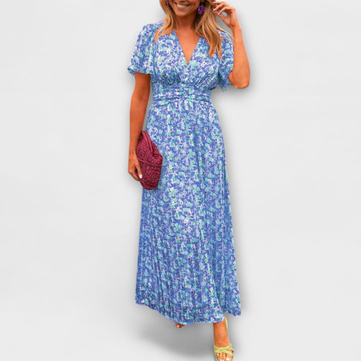 Blue floral V-neck midi dress with short sleeves and gathered waist