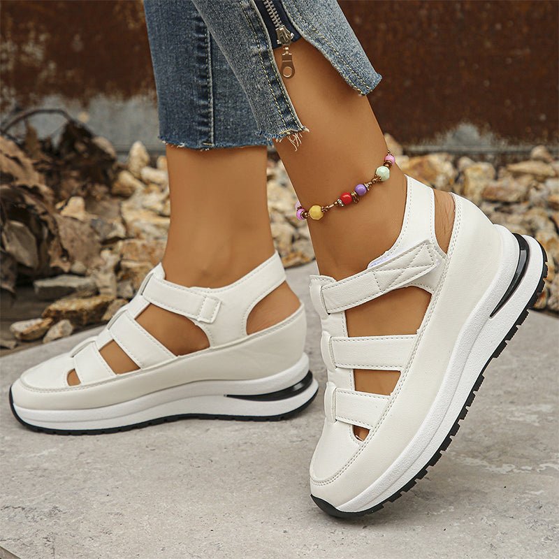 White closed-toe sneaker sandals with 2 hook-and-loop straps and thick tread sole
