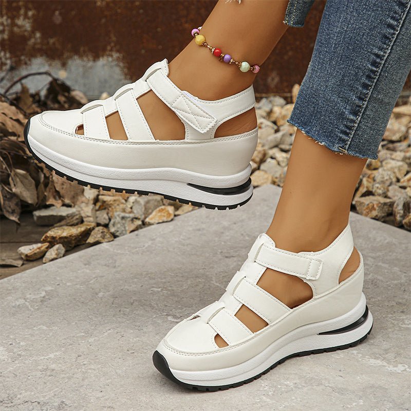 White closed-toe sneaker sandals, front view with three straps and stacked sole