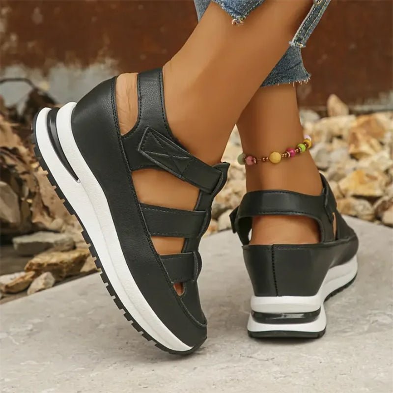 Black closed-toe sneaker sandals with three hook-and-loop straps and cushioned sole