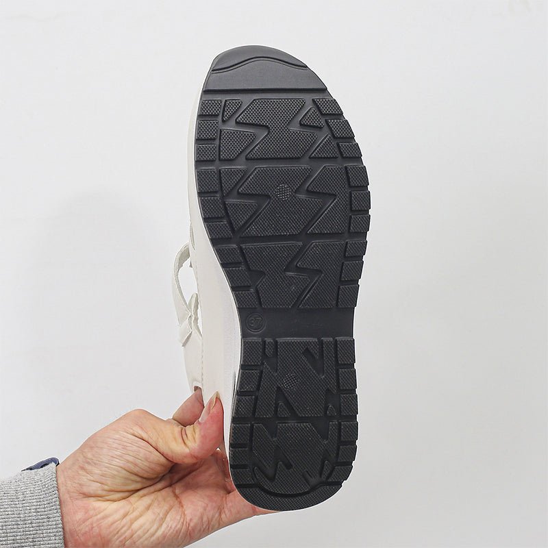 Black sneaker sandal outsole with textured tread pattern on thick platform sole