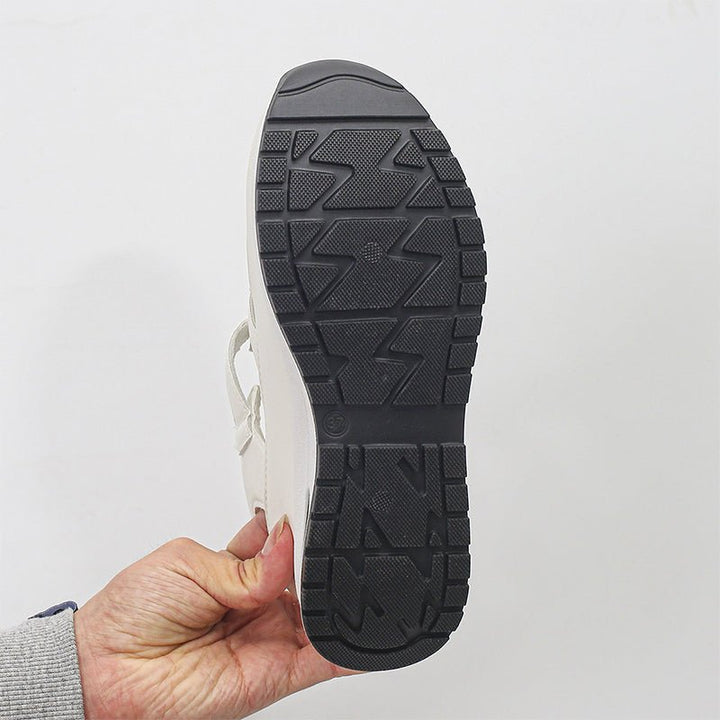 Black sneaker sandal outsole with textured tread pattern on thick platform sole