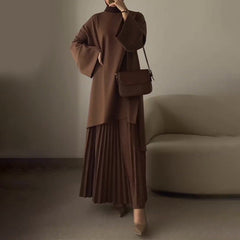 Women's pleated two-piece set, draped brown mock-neck top with wide sleeves and pleated midi skirt