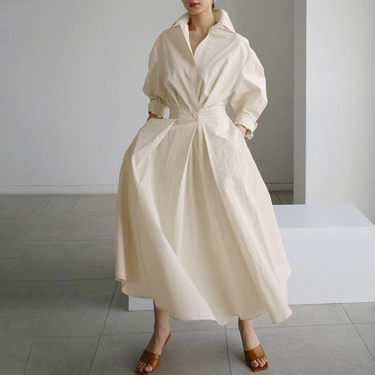 Cream shirt dress with V-neck, button front, long sleeves, and tied waist