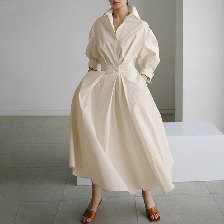 Cream shirt dress with V-neck, button front, long sleeves, and tied waist
