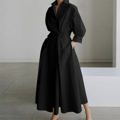 Black shirt dress with button front, long sleeves, and tie waist detail