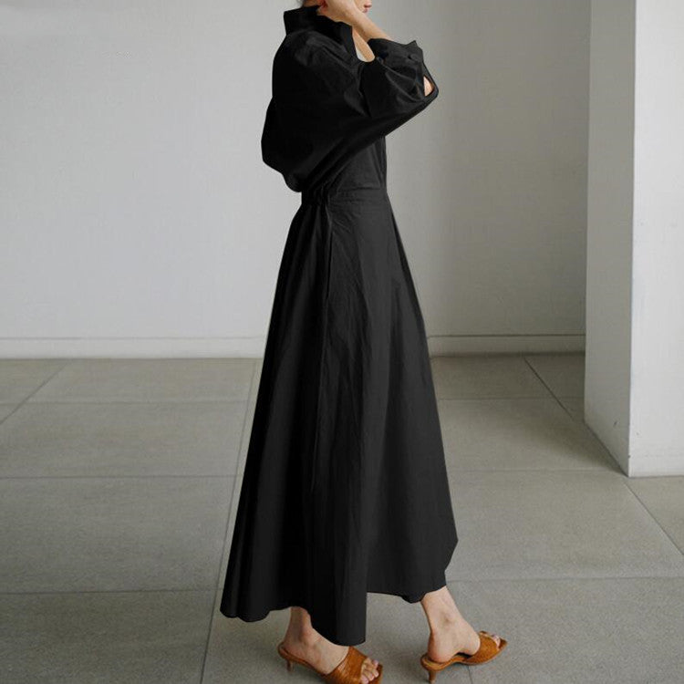 Black shirt dress with button front, long sleeves, and cinched waist detail