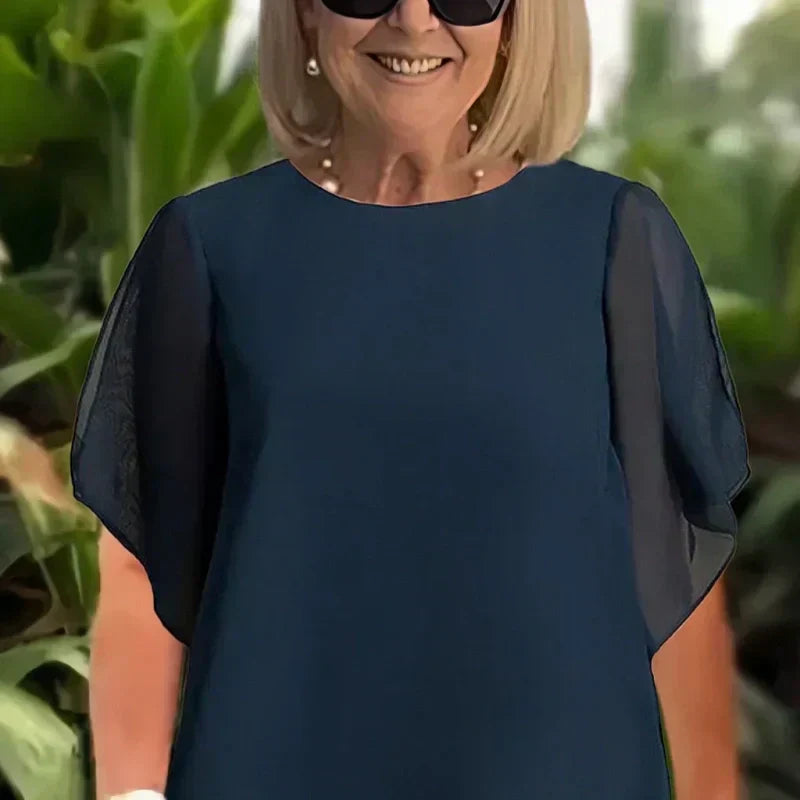Navy blouse top with dolman short sleeves and flowing drape