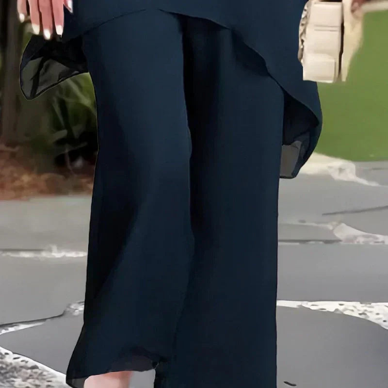 Navy wide-leg pants with front drape and flowing relaxed fit