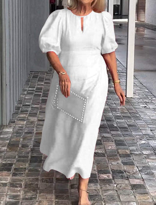 White puff-sleeve midi dress with keyhole neckline and subtle front seam detail