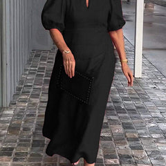 Black puff-sleeve midi dress with keyhole neckline and subtle front seam detail