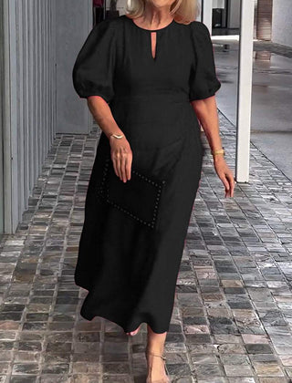 Black puff-sleeve midi dress with keyhole neckline and subtle front seam detail