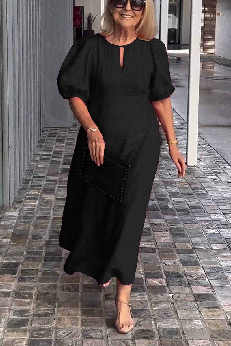 Black puff-sleeve midi dress with keyhole neckline and subtle front seam detail