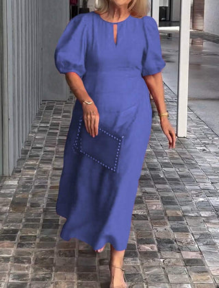 Blue puff-sleeve midi dress with keyhole neckline and subtle front seam detail