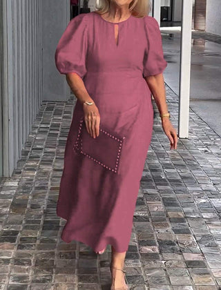 Dark pink puff-sleeve midi dress with keyhole neckline and subtle front seam detail