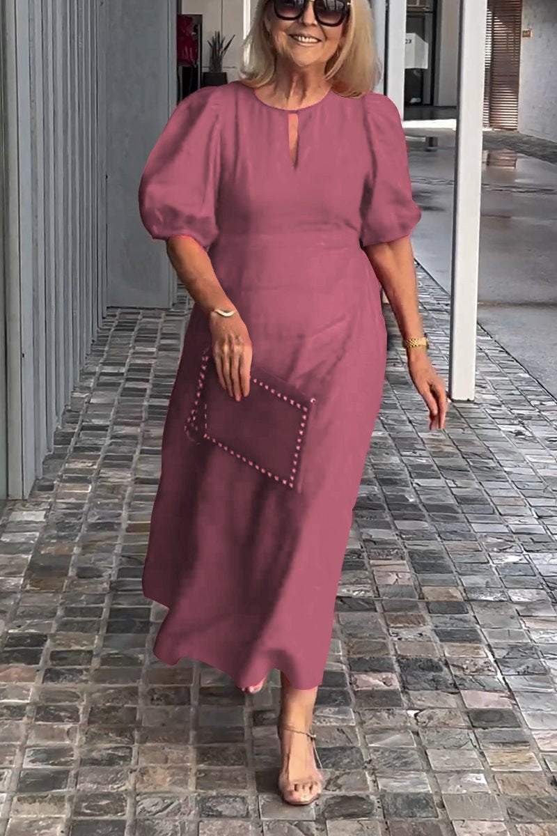 Dark pink puff-sleeve midi dress with keyhole neckline and subtle front seam detail