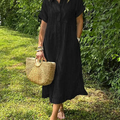 Black striped maxi dress with short sleeves, button front and pockets