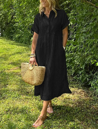 Black striped maxi dress with short sleeves, button front and pockets